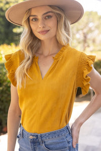 The Patton Suede Ruffle Top